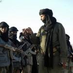 A commander of the Niger Movement for Justice inspects troops in the desert in northern Niger