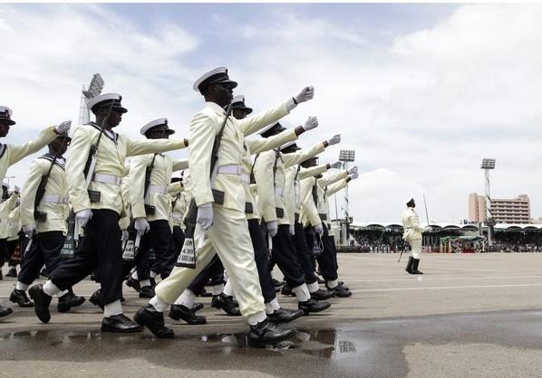 Members of the Nigerian Navy march at a parade marking the 50th anniversary of the country's independence in Abuja