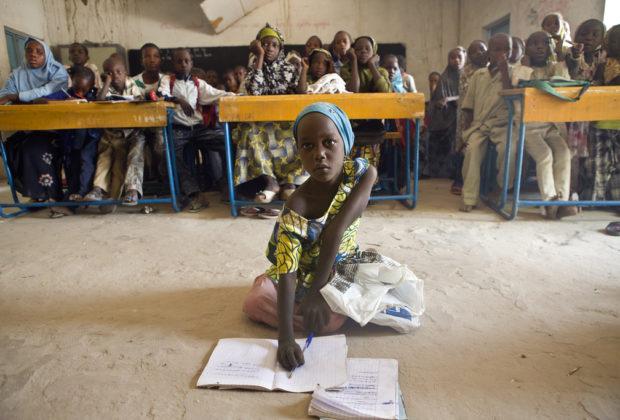 Sala, 6, and her schoolmates study in Niger after being resettled from Nigeria. Credit: UNHCR / H. Caux.