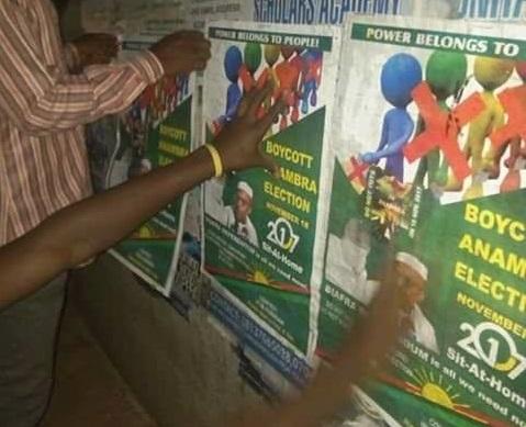 Protesters put up posters calling for the boycott of the Anambra governorship election. Credit: Radio Biafra.