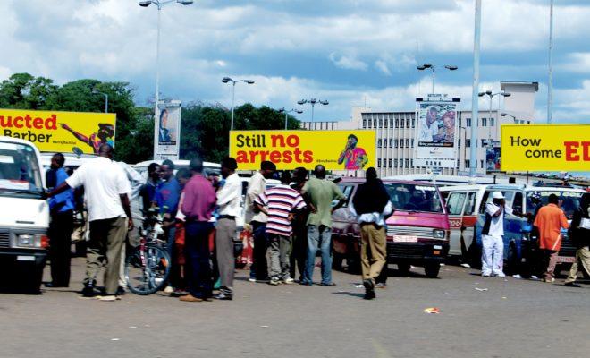 Three Billboards at a Zimbabwe bus terminal asking: "Abducted at the barber. Still no arrests. How come ED [President Mnangagwa]?" Credit: Baynham Goredema.