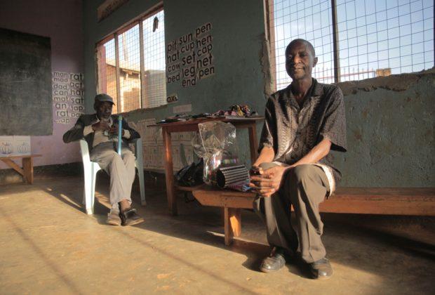 Yusuf Byaruhanga and Israel Bendaki, members of the HIV "positive living group" in Kampala. Credit: Thomas Lewton.