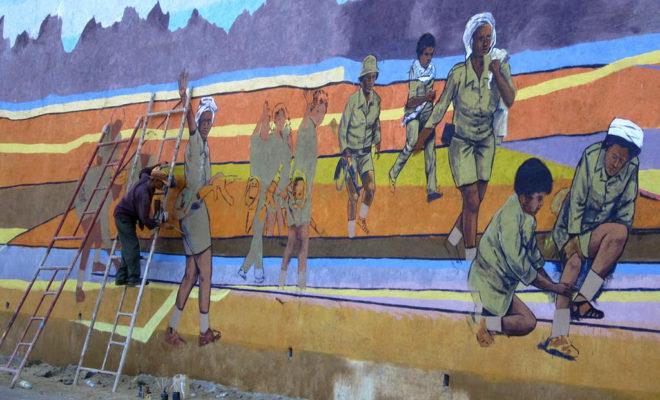 An artist in Eritrea paints a patriotic mural of the war. Credit: David Stanley.