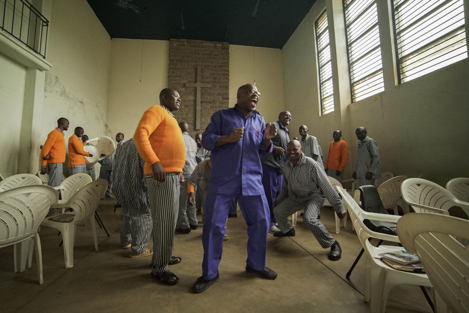 George dances with other inmates at the start of the Man Enough workshop.