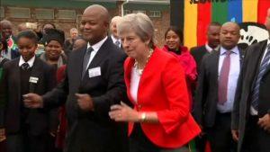 UK Prime Minister Theresa May dances in South Africa.