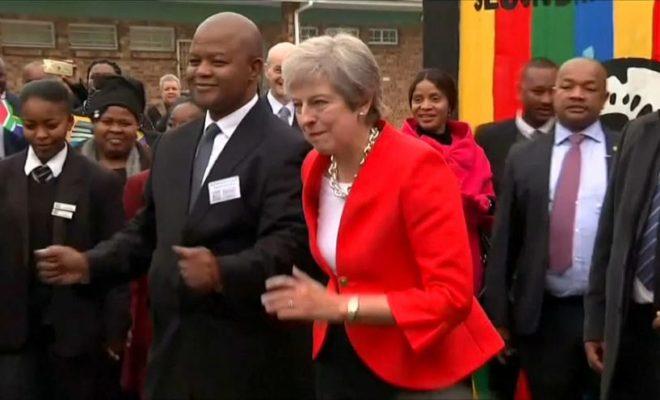 UK Prime Minister Theresa May dances in South Africa.