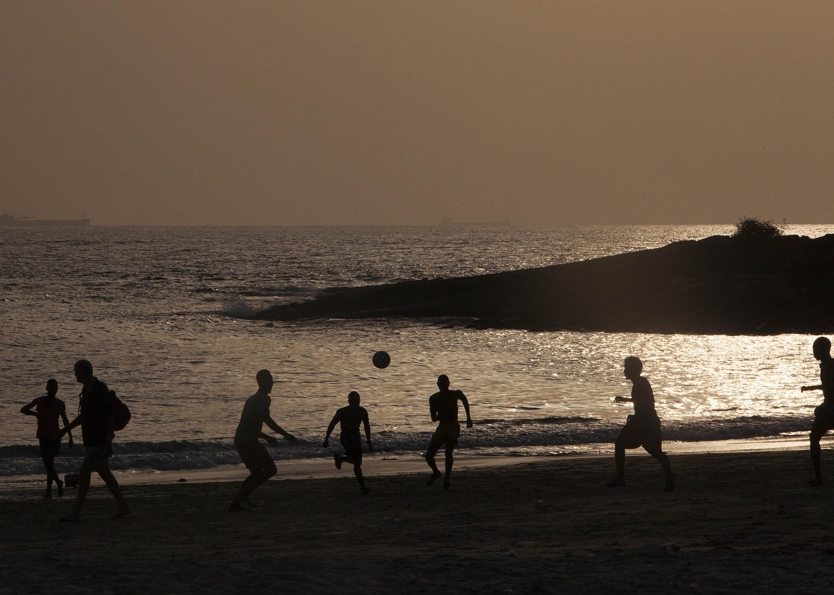 AFCON series: Football playing at the beach in Freetown, Sierra Leone. Credit: Andrew Eseibo / Rele Gallery, Nigeria