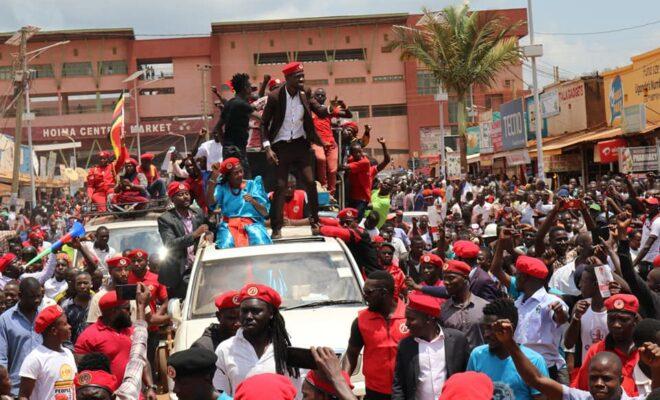 Bobi Wine and supporters at a rally this September don the red beret . Credit: Bobi Wine.