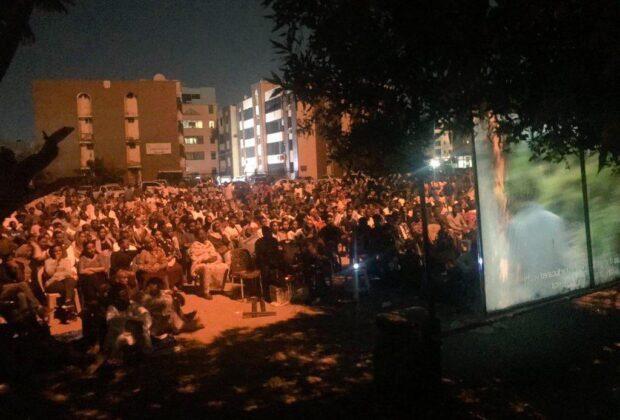 People gather for an open air film screening in Khartoum, Sudan.