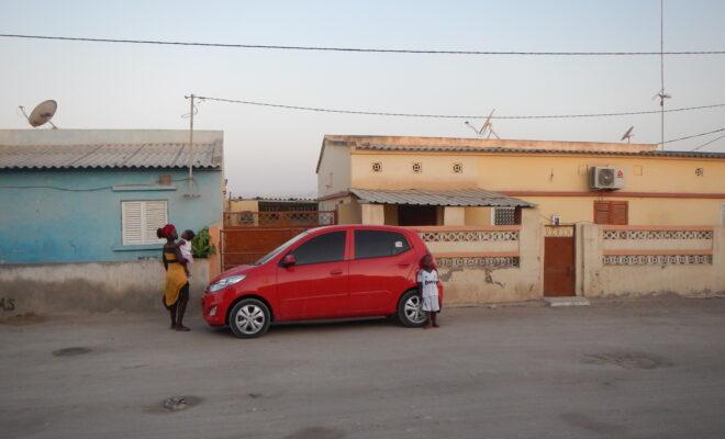 A woman and her children outside their home in one of Lobito's residential neighbourhoods in 2014. Credit: Jess Auerbach.