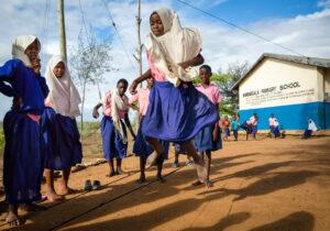 Girls education during coronavirus (COVID-19): Young girls play in the school yard in Kenya. Credit: GPE/Kelley Lynch.