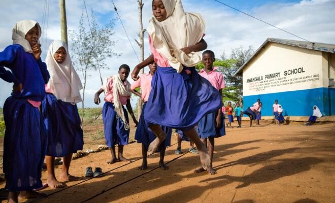 Girls education during coronavirus (COVID-19): Young girls play in the school yard in Kenya. Credit: GPE/Kelley Lynch.