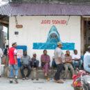 tanzania coronavirus covid-19: People gather on a corner in Stone Town, Zanzibar. Credit: Frans Peeters.