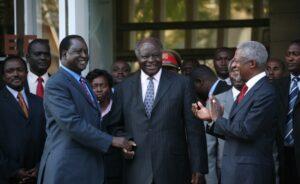 Mwai Kibaki shakes hands with opposition leader Raila Odinga during peace talks mediated by Kofi Annan in Kenya, January 2008. Credit: Boniface Mwangi/IRIN.