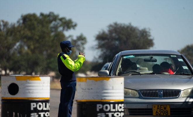 Zimbabwe doctor A police officer at a checkpoint in Bulawayo, Zimbabwe. Credit: KB Mpofu / ILO.