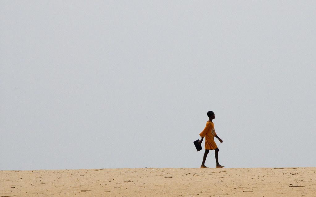 education A girl walking to school in Ghana. Credit: Arne Hoel/The World Bank.
