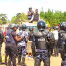 The police block opposition presidential candidate Bobi Wine in December 2020 during the Uganda presidential election campaign. Credit: HEBobiwine.