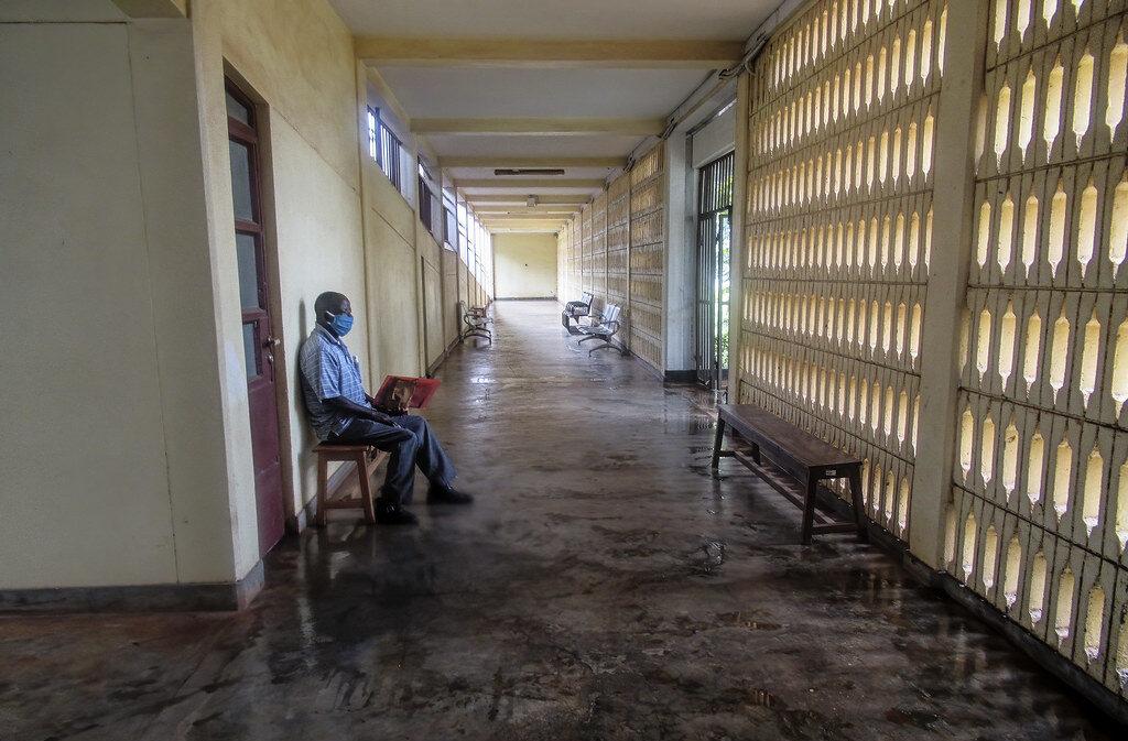 elections. A man waits in a hospital during the COVID-19 pandemic in Tanzania. Credit: Edith Macha.