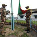 Cameroon Defence Forces members prepare to hoist the Cameroon national flag. Credit: Master Sgt. MSgt Stan Parker, 621st CRW Public Affairs.