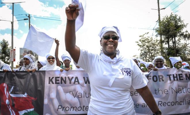 Ahead of Kenya's 2017 elections, the White Ribbon Campaign march to promote their rapid response hotline which responds to violence against women in elections. Credit: Carla Chianese, IFES.