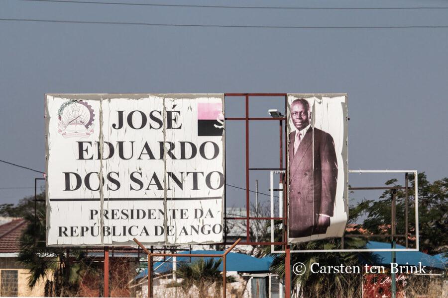 A dilapidated billboard of former president Jose Eduardo Dos Santos. Credit: Carsten ten Brink.