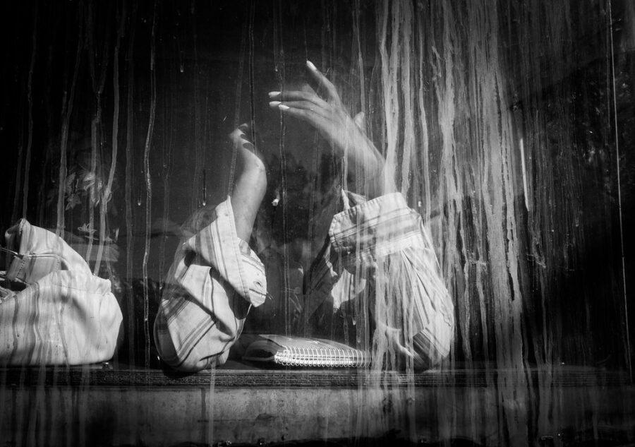 A man obscured in a window in Addis Ababa. Credit: Thomas Leuthard.