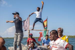 Men cheer on their friend as they follow in a boat. During the port’s construction, which involved dredging the ocean floor, coral reefs were destroyed, locals say the number of sea turtles has dramatically decreased, and snorkelling is no longer possible around the port. As tourism suffers, the demand for dhows has also waned, putting the intergenerational tradition of dhow-making in jeopardy.