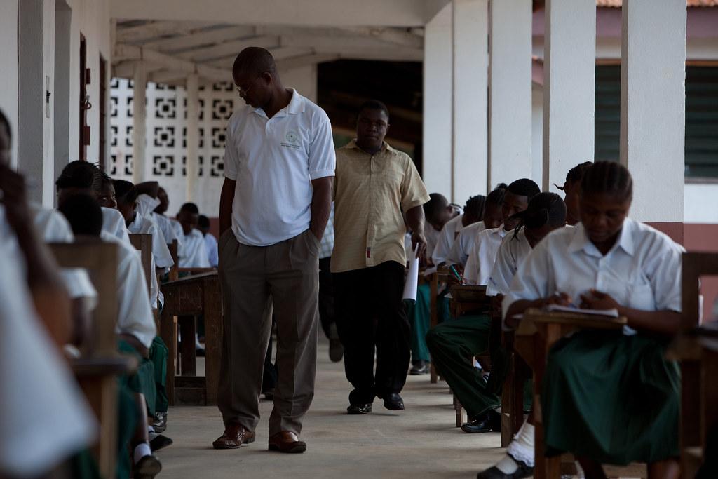 High school students sit an exam in Rivercess County, Liberia. Credit: Faces – Together Liberia – Bruce Strong.