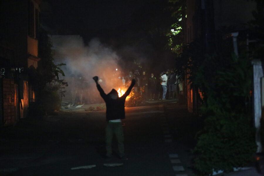 Protesters set fire to barricades during the April cost of living protests. Credit: Vel Moonien.