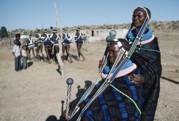 Two women from the Ndebele tribe wait for the start of an initiation ceremony. Credit: UN Photo/P.