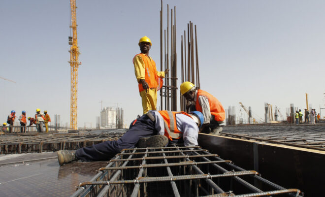 Migrant works on a construction site in Qatar. Credit: ILO/Apex Image.