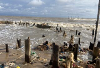The remains of buildings lost to the sea in Ayetoro. Credit: Abiodun Jamiu.