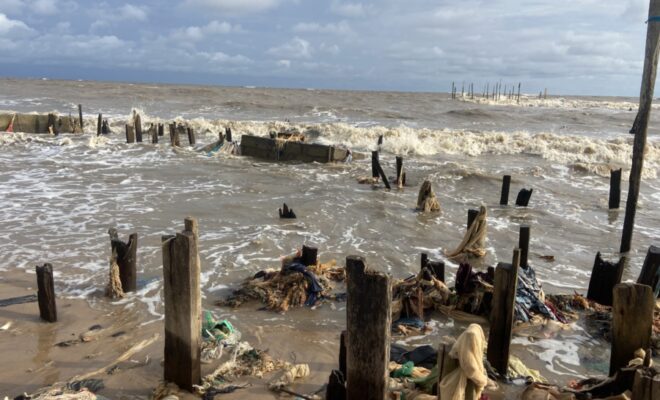 The remains of buildings lost to the sea in Ayetoro. Credit: Abiodun Jamiu.