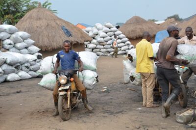 Motorcycle tax operators, or boda boda drivers, also benefit from the charcoal trade by transporting it. Credit: John Okot.
