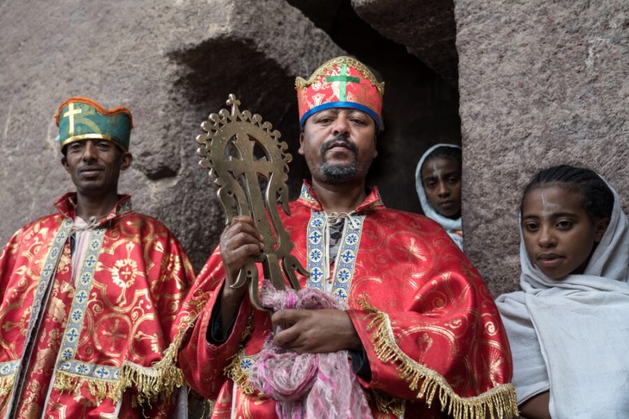 A priest holds the golden cross which was stolen from Biete Medhane Alem in 1997, but returned to Ethiopia in 2001. Credit: Jaclynn Ashly.