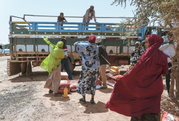 Women in Wado-Baris wait next to a food aid delivery truck in Wado-Baris, Somaliland. Credit: Jaclynn Ashly.