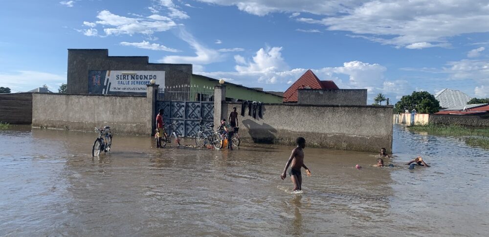 Children play in the floods in Gatumba, Burundi. Credit: Lorraine Josiane Manishatse.