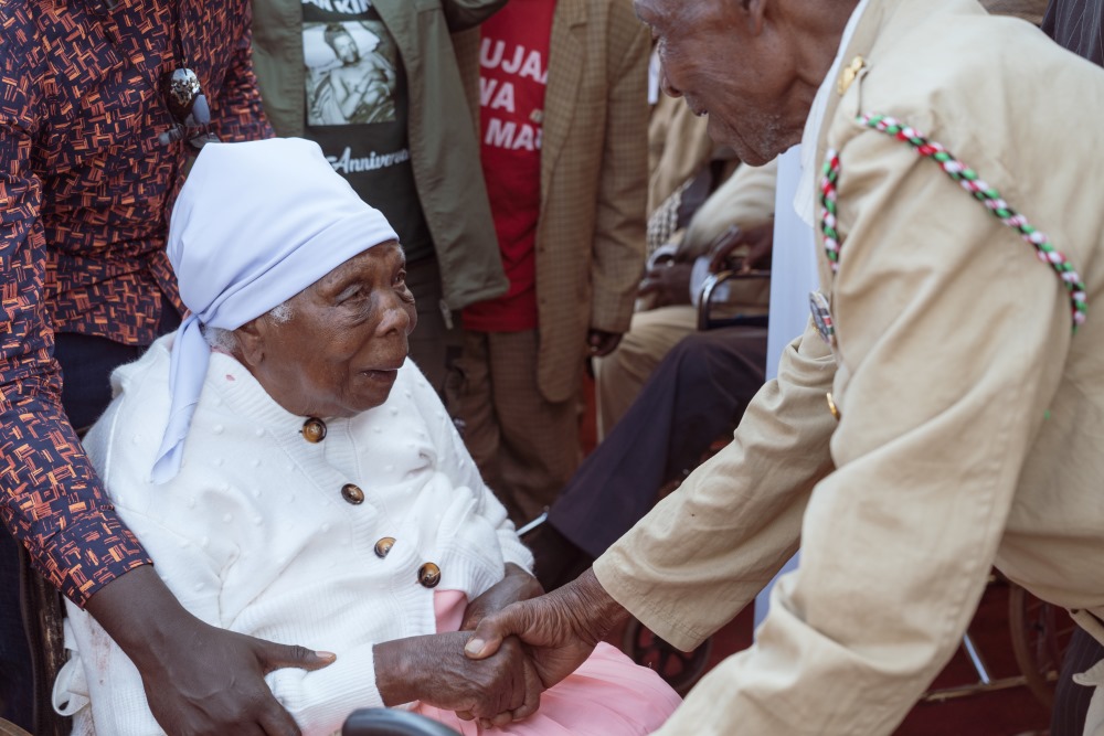 Mukami Kimathi is greeted by Mau Mau veterans during an event in Nyeri before her death. Credit: Jaclynn Ashly.